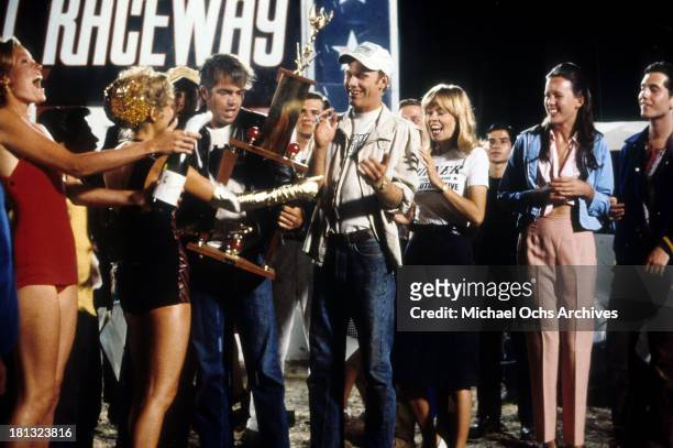 Actor Paul Le Mat and Ron Howard and actress Anna Bjorn on the set of Universal Studios movie " More American Graffiti" in 1979.