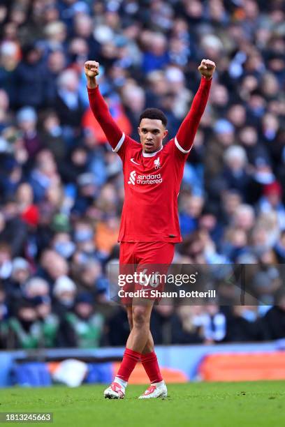 Trent Alexander-Arnold of Liverpool celebrates after scoring the team's first goal during the Premier League match between Manchester City and...