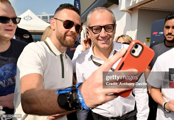 Stefano Domenicali, CEO of Formula One Group, poses for photographs with guests following a Q&A at the Atmosphere Pool Global partner of Formula 1®,...