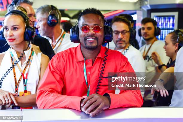 Patrice Evra looks on in the Red Bull Racing garage during qualifying ahead of the F1 Grand Prix of Abu Dhabi at Yas Marina Circuit on November 25,...