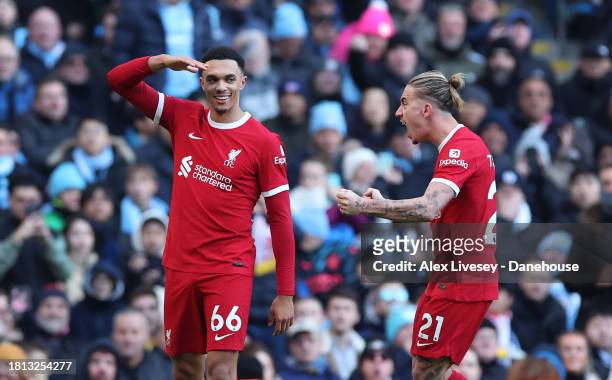 Trent Alexander-Arnold of Liverpool FC celebrates with Konstantinos Tsimikas after scoring their first goal during the Premier League match between...