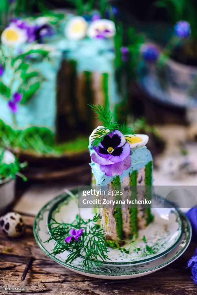 Fish layer cake with tuna mousse and quail eggs