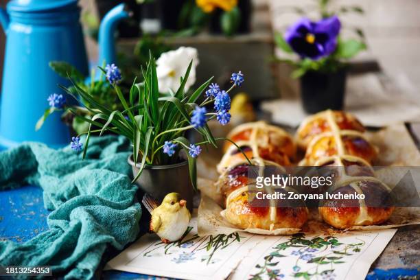 floral hot cross buns..traditional  easter pastries - hot cross bun stock pictures, royalty-free photos & images
