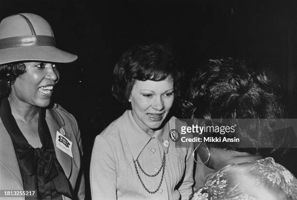 American Civil Rights activist Ethel Barnett and former Georgia First Lady Rosalynn Carter speak with an unidentified woman during a campaign event...