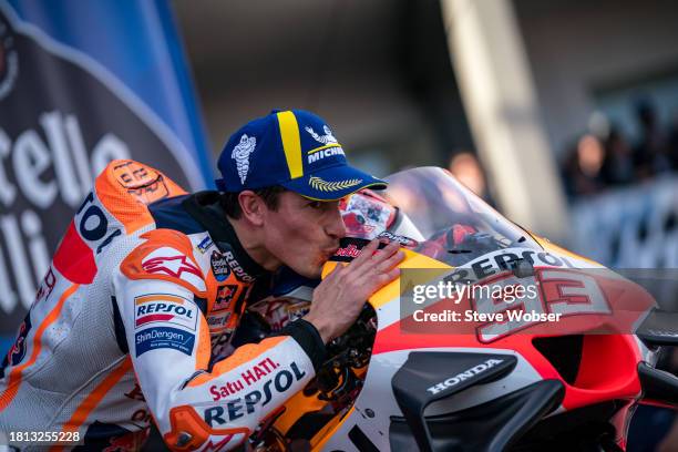 Marc Marquez of Spain and Repsol Honda Team kisses his bike on the Podium during the Sprint race of the MotoGP Gran Premio Motul de la Comunitat...