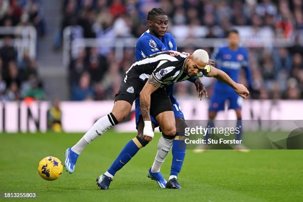 Lesley Ugochukwu of Chelsea battles for possession with Joelinton of Newcastle United during the Premier League match between Newcastle United and...