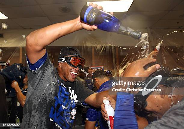 Pitcher Carlos Marmol of the Los Angeles Dodgers celebrates in the locker room after defeating the Arizona Diamondbacks to clinch the National League...