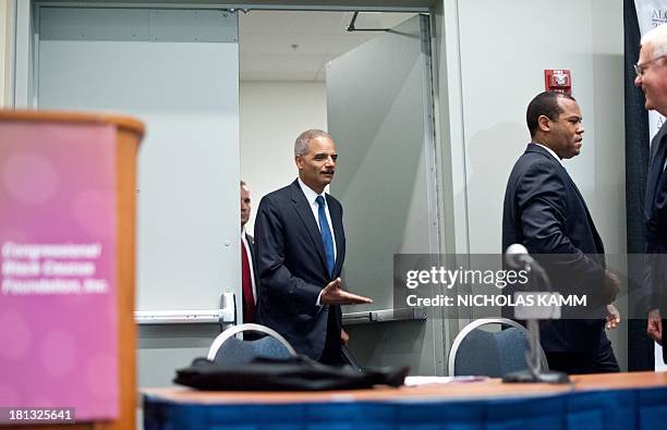 Attorney General Eric Holder arrives to address the Congressional Black Caucus Annual Legislative Conference during a public policy forum on voting...