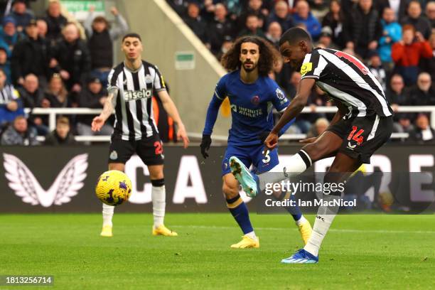 Alexander Isak of Newcastle United scores the team's first goal during the Premier League match between Newcastle United and Chelsea FC at St. James...