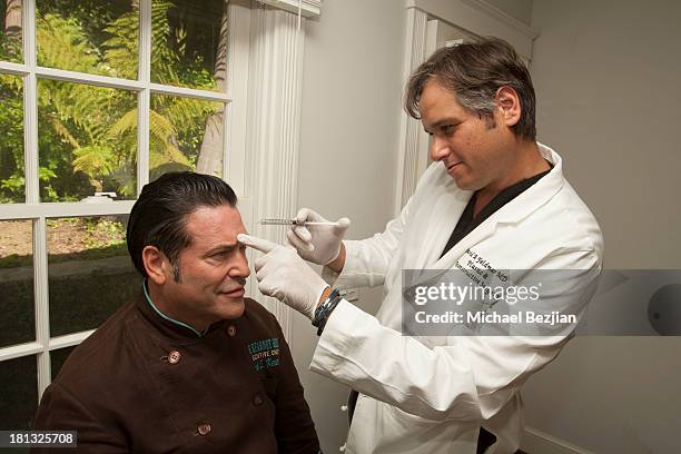 Celebrity chef Mark Kearney gets a treatment from Dr. David A. Feldmar at the Mark Kearney Group - "Iced Out" Luxury Emmy Suite on September 19, 2013...