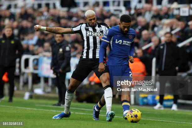 Joelinton of Newcastle United battles for possession with Reece James of Chelsea during the Premier League match between Newcastle United and Chelsea...