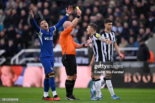 Referee, Simon Hooper shows a yellow card to Kieran Trippier of Newcastle United during the Premier League match between Newcastle United and Chelsea...