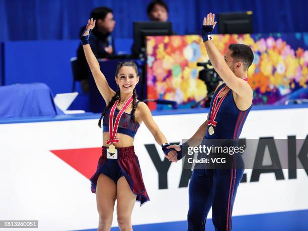 Gold medalists Lilah Fear and Lewis Gibson of Great Britain pose at the medal ceremony for the Ice Dance competition during the ISU Grand Prix of...