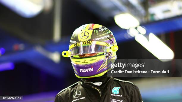 11th placed qualifier Lewis Hamilton of Great Britain and Mercedes looks on in the FIA garage during qualifying ahead of the F1 Grand Prix of Abu...