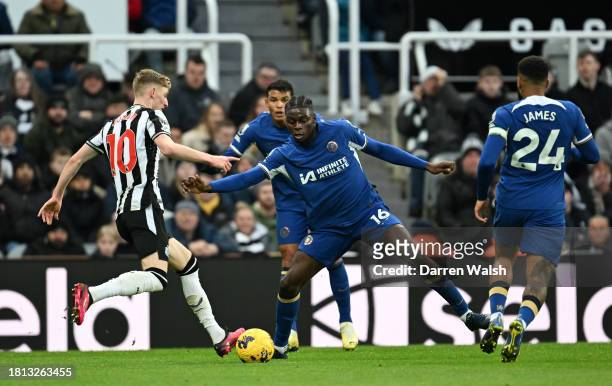 Anthony Gordon of Newcastle United is challenged by Lesley Ugochukwu of Chelsea during the Premier League match between Newcastle United and Chelsea...