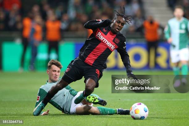 Jeremie Frimpong of Bayer Leverkusen is fouled by Olivier Deman of Werder Bremen, a foul which results in a yellow card, during the Bundesliga match...
