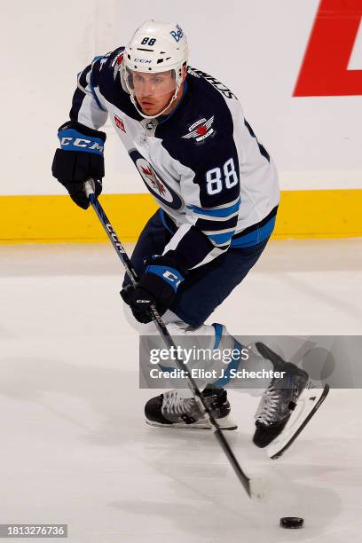 Nate Schmidt of the Winnipeg Jets skates with the puck against the Florida Panthers at the Amerant Bank Arena on November 24, 2023 in Sunrise,...