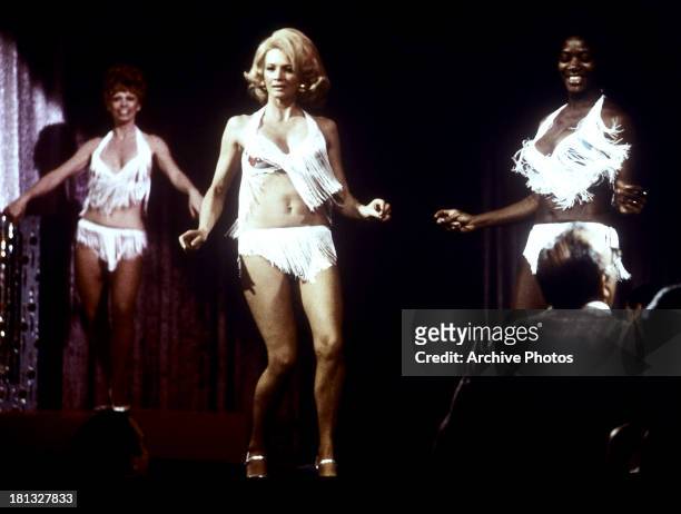 Angie Dickinson dances in a scene from the TV series, 'Police Woman', circa 1975.