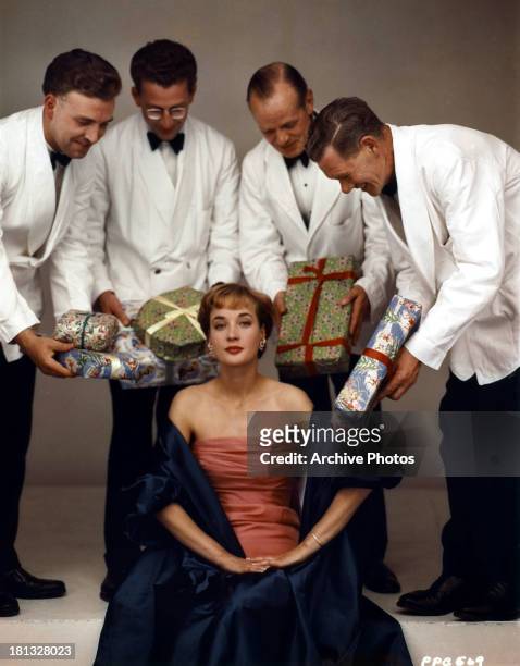 Sylvia Syms receives gifts in publicity portrait, circa 1965.