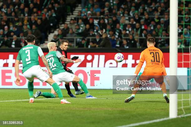 Alex Grimaldo of Bayer Leverkusen scores the team's third goal during the Bundesliga match between SV Werder Bremen and Bayer 04 Leverkusen at...