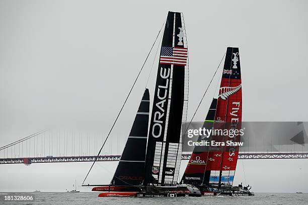 Emirates Team New Zealand skippered by Dean Barker in action against Oracle Team USA skippered by James Spithill in race 13 of the America's Cup...