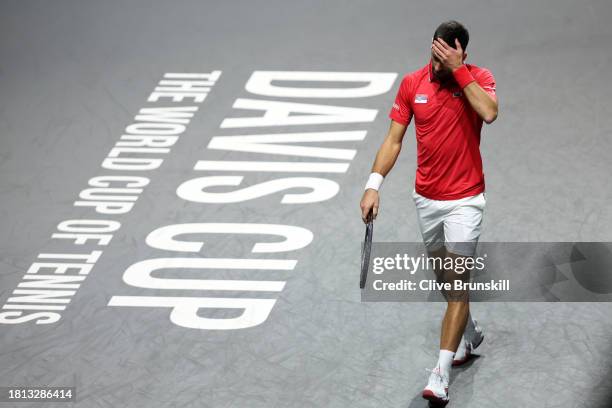 Novak Djokovic of Serbia reacts during the Semi-Final match against Jannik Sinner of Italy in the Davis Cup Final at Palacio de Deportes Jose Maria...