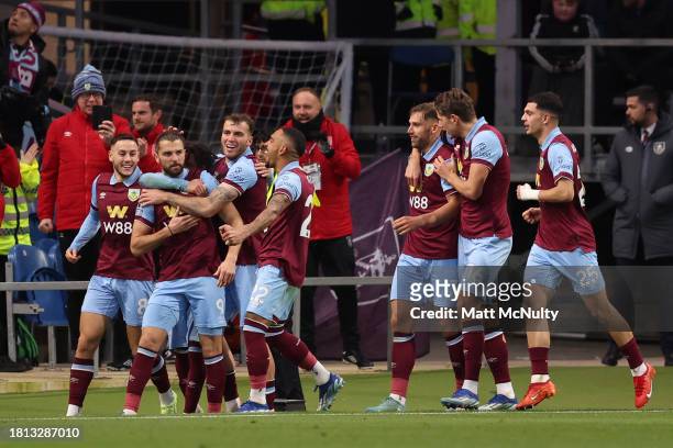 Jay Rodriguez of Burnley celebrates with teammates after scoring the team's first goal from a penalty kick during the Premier League match between...