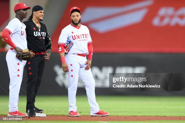 Didi Gregorius of the United West All-Stars, Jefry Marte of the United East All-Stars, and Robinson Cano look on during the Baseball United Showcase...