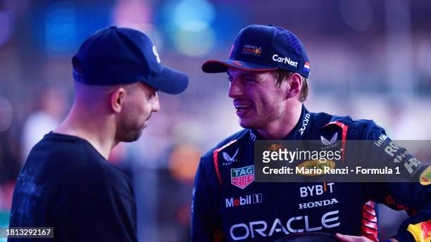 Pole position qualifier Max Verstappen of the Netherlands and Oracle Red Bull Racing talks with Sergio Aguero in parc ferme during qualifying ahead...