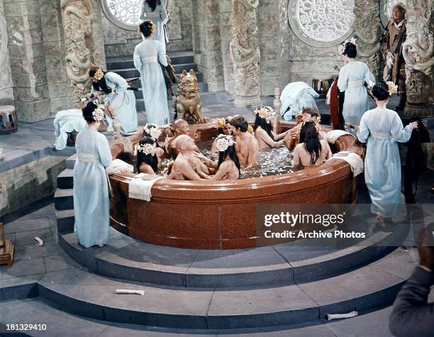 Telly Savalas and others bathe together in a scene from the film 'Genghis Khan', 1965.