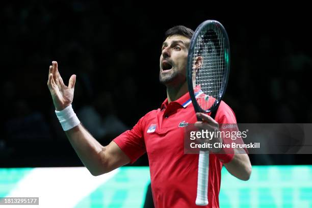 Novak Djokovic of Serbia reacts during the Semi-Final match against Jannik Sinner of Italy in the Davis Cup Final at Palacio de Deportes Jose Maria...