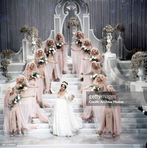 Barbra Streisand sings in a wedding dress in a scene from the film 'Funny Girl', 1968.