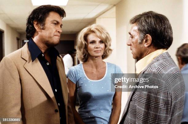 Earl Holliman and Angie Dickinson in a scene from the TV series, 'Police Woman', circa 1975.
