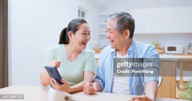 old couple test blood pressure - cuff sleeve stock pictures, royalty-free photos & images