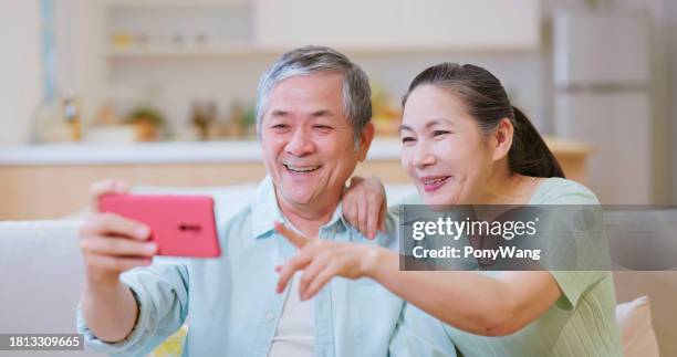 old couple video call - friends laughing at iphone video stock pictures, royalty-free photos & images