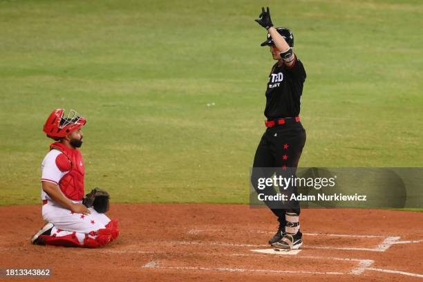 Brantley Bell of the United East All-Stars celebrates his home run in front of Wilin Rosario of the United West All-Stars during the Baseball United...