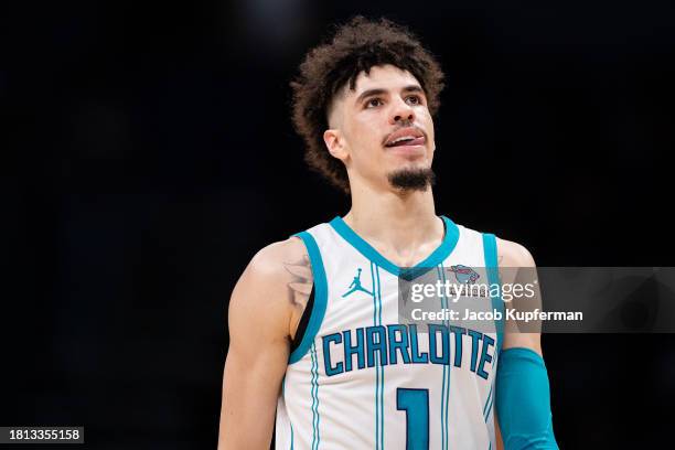 LaMelo Ball of the Charlotte Hornets looks on during their game against the Washington Wizards at Spectrum Center on November 22, 2023 in Charlotte,...