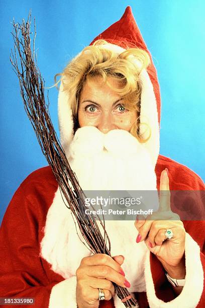 Margot Eskens, als Weihnachtsmann bzw. Nikolaus verkleidet, , Verkleidung, Rute, Advent, Adventszeit, Winter, Weihnachten, Weihnachtszeit,...