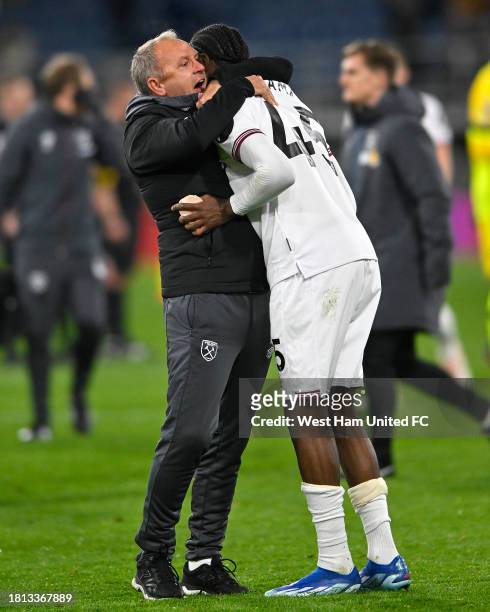 Divin Mubama of West Ham United gets a hug from his manager of last year, Mark Robson, who has moved up into the 1st team as assistant following the...