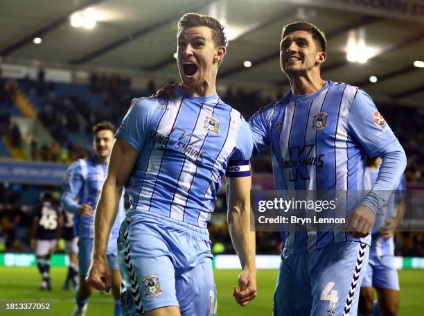 Ben Sheaf of Coventry celebrates with team mate Bobby Thomas after scoring their third goal during the Sky Bet Championship match between Millwall...
