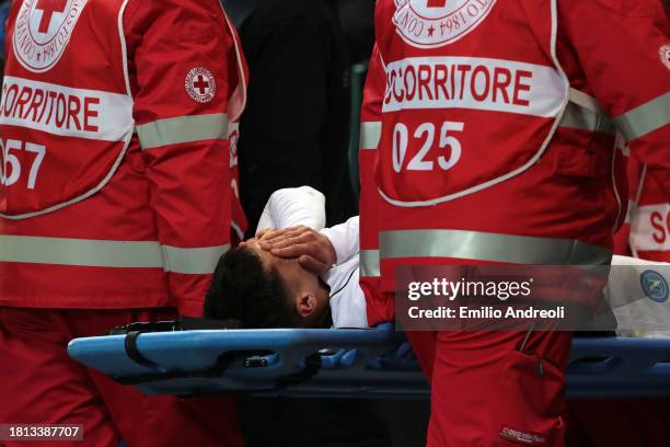 Mathias Olivera of SSC Napoli looks dejected as he leaves the field on a stretcher after sustaining an injury during the Serie A TIM match between...