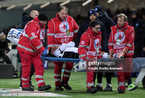 Mathias Olivera of SSC Napoli looks dejected as he leaves the field on a stretcher after sustaining an injury during the Serie A TIM match between...