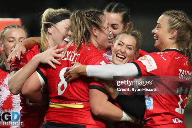 Sarah Beckett of Gloucester Hartpury celebrates with teammates after scoring their sides fourth try during the Allianz Premiership Women's Rugby...