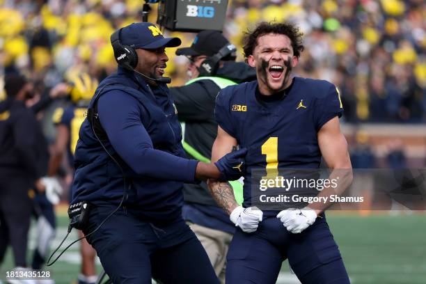 Roman Wilson of the Michigan Wolverines celebrates after the official review stands for the touchdown against the Ohio State Buckeyes during the...