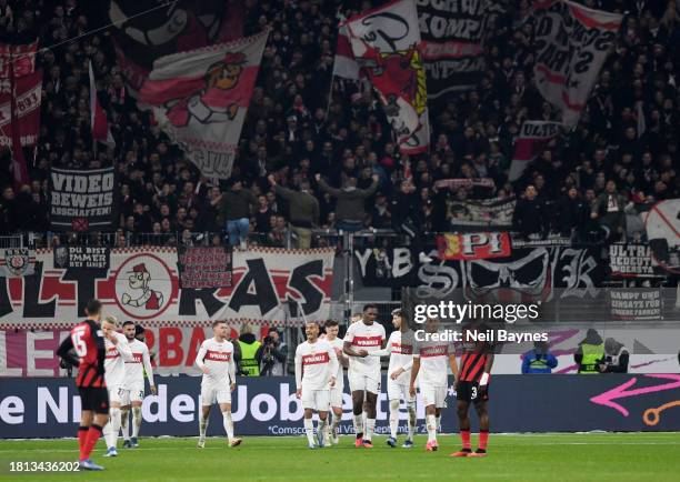 Deniz Undav of VfB Stuttgart celebrates with teammates after scoring the team's second goal during the Bundesliga match between Eintracht Frankfurt...