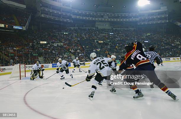 Goaltender Sebastien Caron, Michal Rozsival and Marc Bergevin of the Pittsburgh Penguins defend as Peter Worrell of the Florida Panthers attempts to...