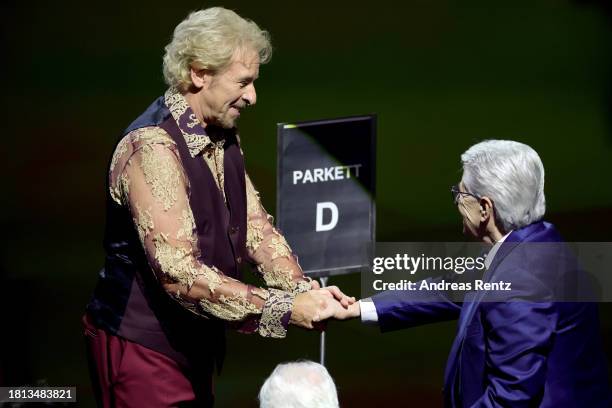 Thomas Gottschalk and Frank Elstner greet each other on stage ahead of the "Wetten, Dass ...?" tv show on November 25, 2023 in Offenburg, Germany.