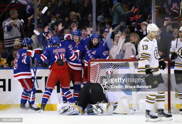 Chris Kreider of the New York Rangers scores powerplay goal at 10:56 of the first period against the Boston Bruins at Madison Square Garden on...