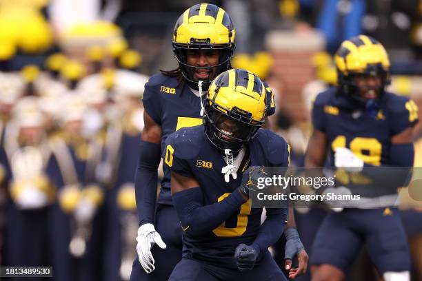 Mike Sainristil of the Michigan Wolverines celebrates a defensive stop against the Ohio State Buckeyes during the second quarter in the game at...