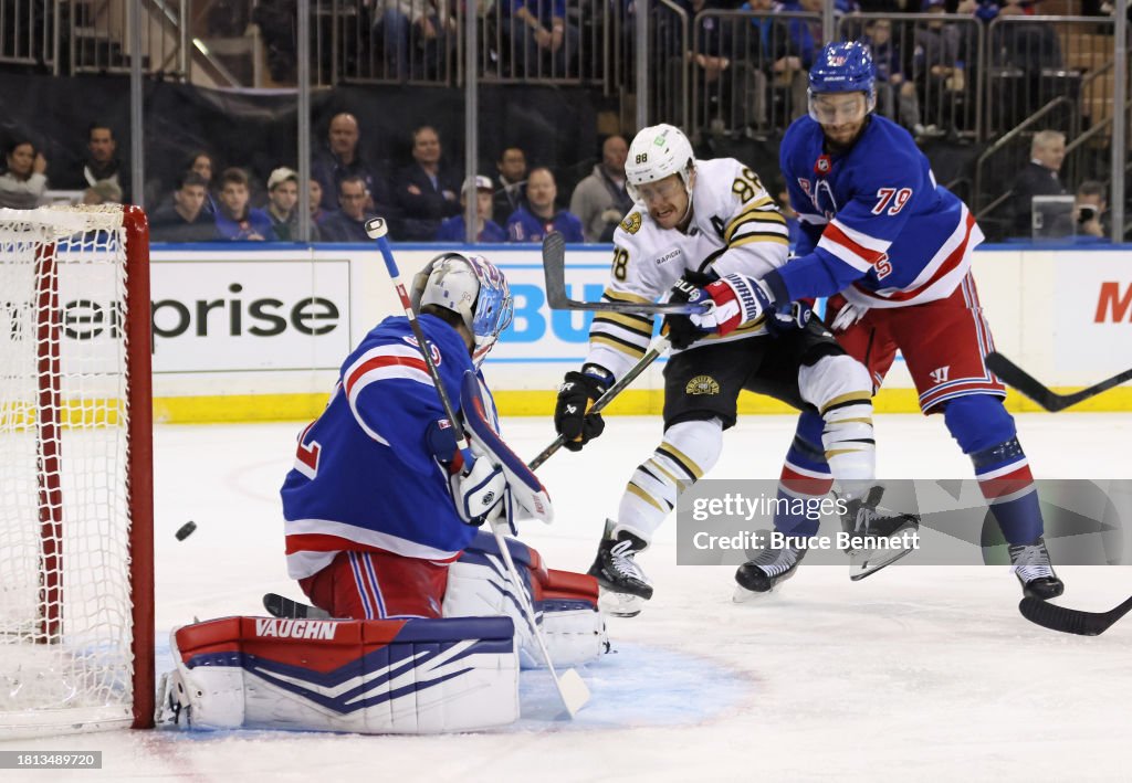 Jonathan Quick and K'Andre Miller of the New York Rangers defend ...